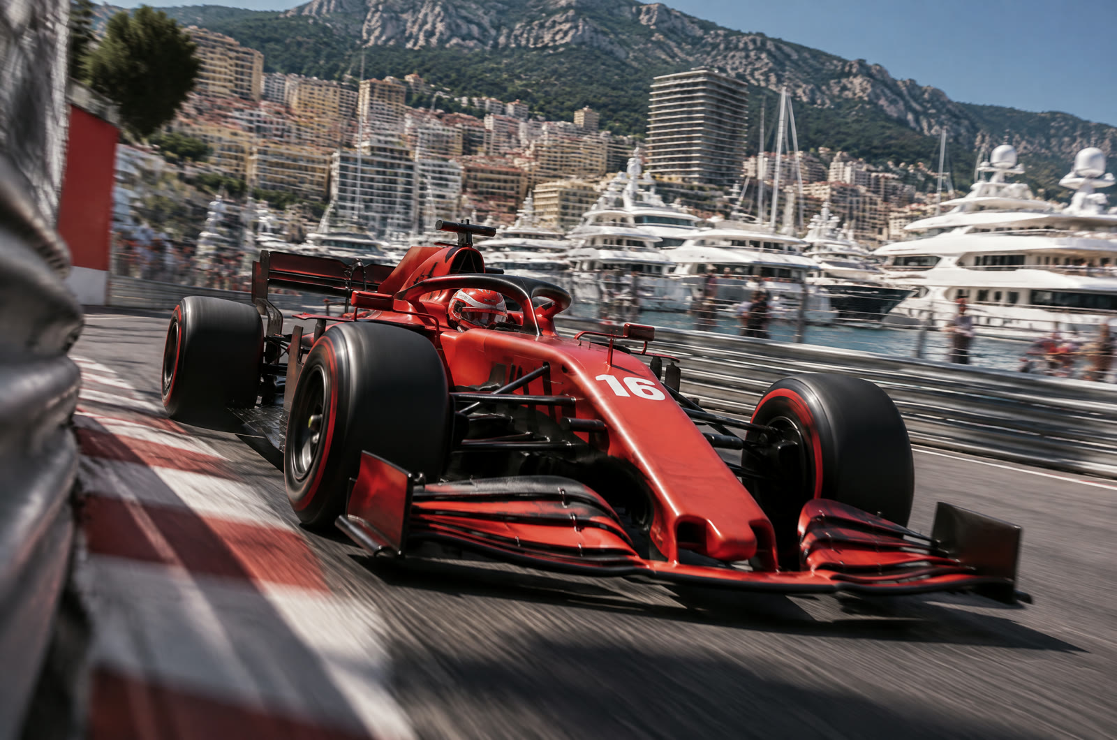 The number 16 Ferrari through the Monaco harbour chicane