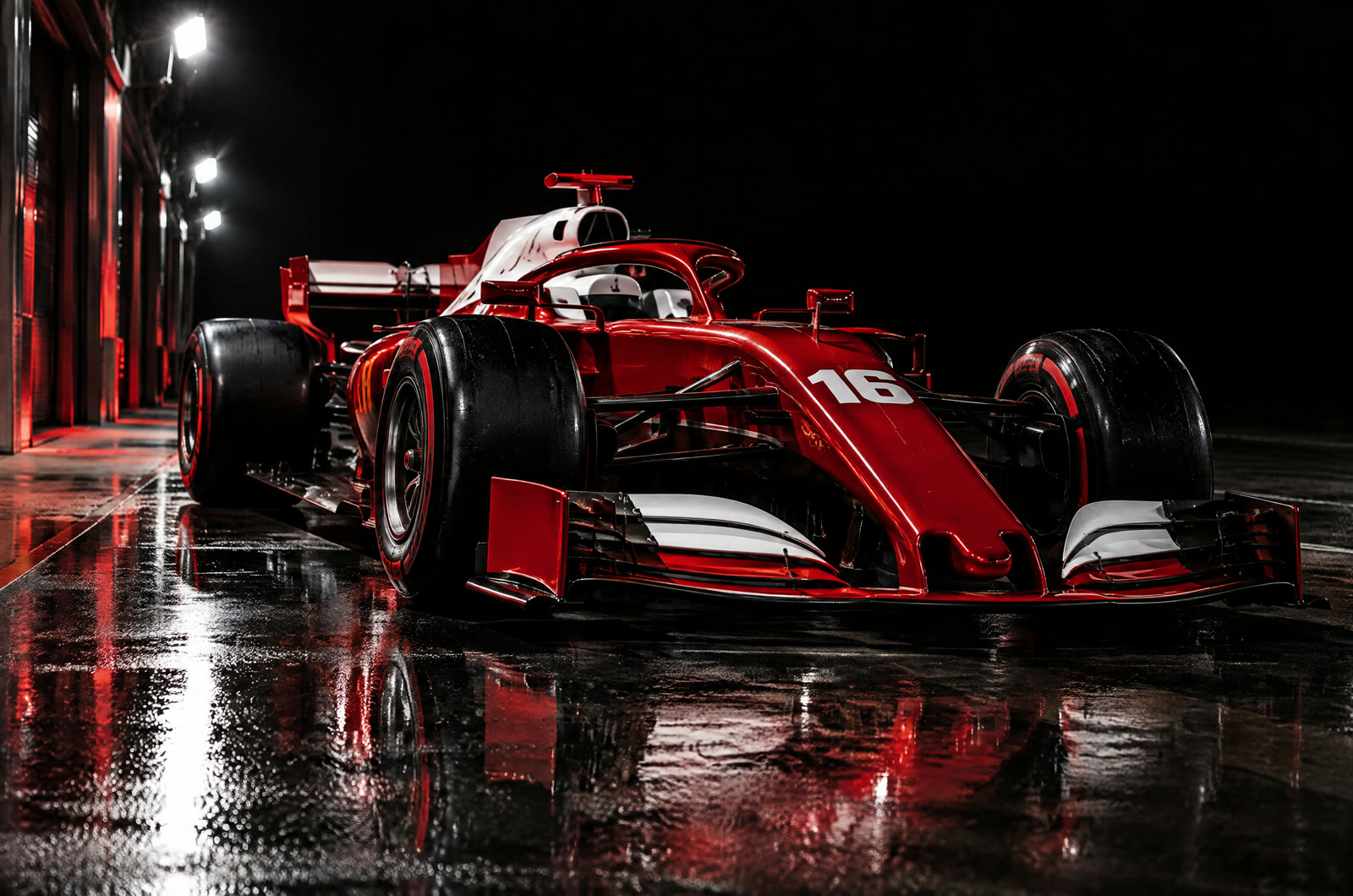 The Ferrari SF-26 in the pit lane at night